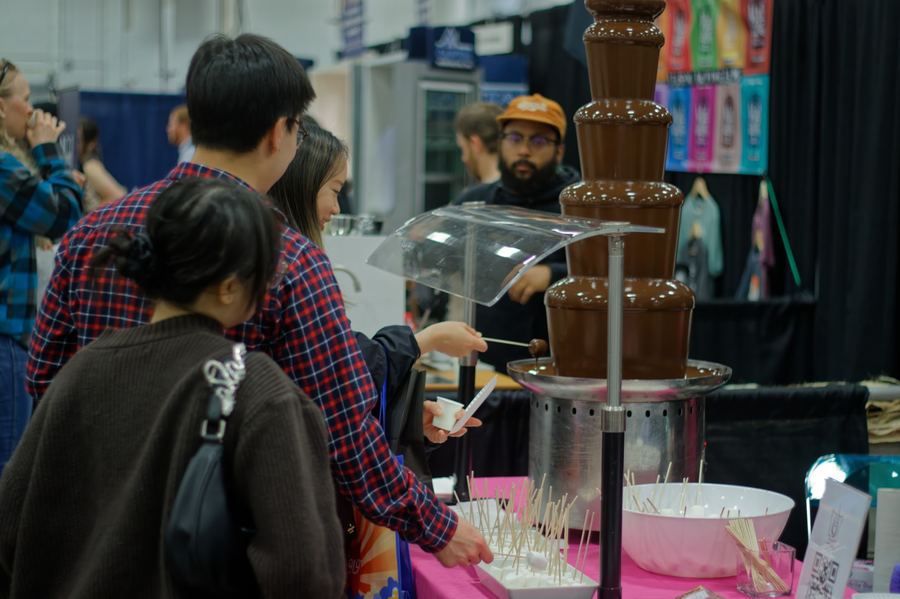 Guests gathered around a flowing chocolate fountain.